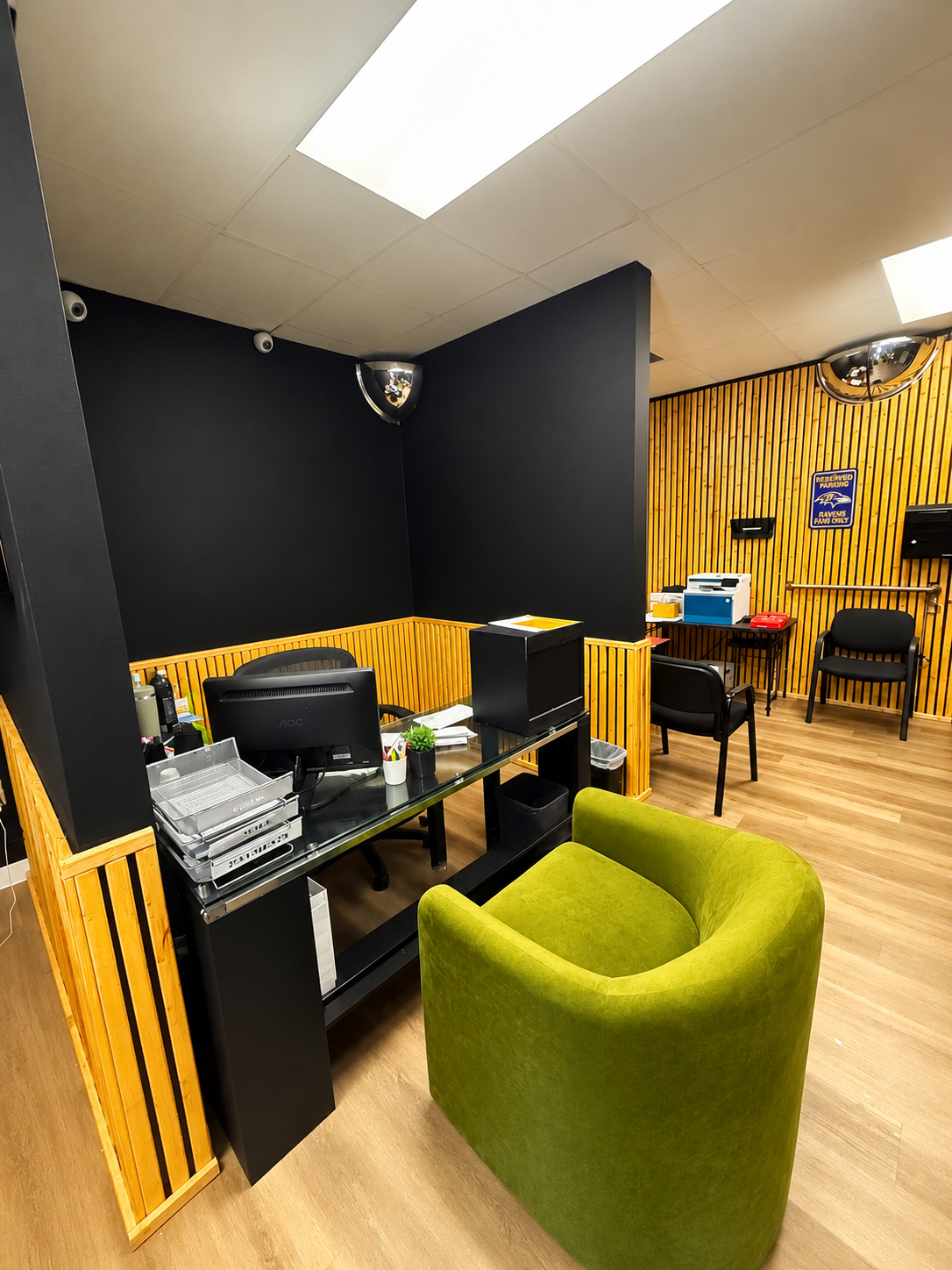 Golder Bail Bonds office workspace with yellow and black walls