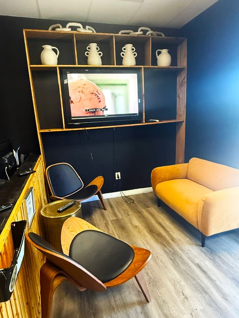 Golder Bail Bonds lounge with yellow furniture and shelving